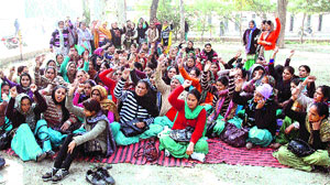 Health workers stage a protest in support of their demands at the Civil Hospital in Bathinda on Monday. 