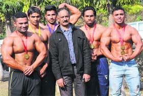 Winners of the bodybuilding championship at the Gymnasium Hall of Panjab University in Chandigarh on Monday