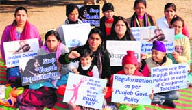 Computer teachers protest at the Masjid Ground, Sector 20, Chandigarh, on Monday