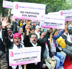 Activists of All India LPG Distributors Federation raise slogans during their protest march to oppose the pathetic working conditions of the distributors in New Delhi on Monday. 