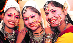 Girls before their performance at at the Municipal Corporation Hall in Dehradun on Monday. 