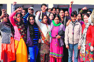 Irked by the bad condition of roads and rise in the number of accidents, residents protest outside the Public Works Department office in Haridwar on Monday. 