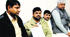 INLD leader Dushyant Chautala (second from left) releases a list of favourite appointees in Rohtak on Monday.