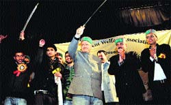 Chief Minister Virbhadra Singh holds a sword during the cultural function of the Nankhari Students Welfare Association at the Gaiety Theatre in Shimla on Monday. Photo Amit Kanwar