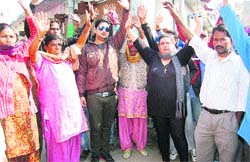 Residents of New Ratan Nagar protest against an encroachment drive in Jalandhar on Monday. A Tribune photograph