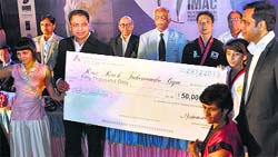 Trainees of Rose Rock Taekwondo Gym receive the runners-up prize at the International Martial Art Championship in Mumbai. A Tribune photograph