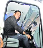 MS Dhoni goes behind the wheels of a truck during a promotional event in New Delhi on Monday.  Manas Ranjan