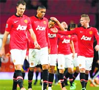 Manchester United players walk off the pitch after losing their English FA Cup match against Swansea City at Old Trafford in Manchester. AFP