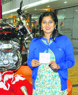 Caroline Dangwal gives away the Harley Davidson bike