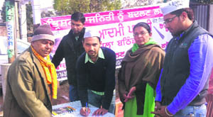 AAP workers during their membership drive in Bathinda on Tuesday. 