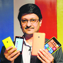 Viral Oza, director (marketing), Nokia India, poses with Lumia 1320 and Lumia 525 at their launch in New Delhi on Tuesday. While Lumia 1320 is priced at Rs 23,999, Lumia 525 costs Rs 10,329.