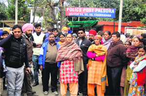 Residents of Sector 56, Chandigarh, protest the arrest of a youth in connection with the kidnapping of a minor girl.