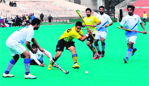 Players of the AG Punjab and the AG UP in action during the North Zone IA&AD Hockey Tournament at the hockey stadium in Sector 42 on Tuesday. 