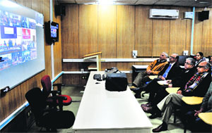 Professor AK Grover (second from right) Vice-Chancellor, Panjab University, along with associates, attends the videoconferencing session with President Pranab Mukherjee at Panjab University on Tuesday