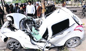 The mangled remains of a Maruti Swift car that hit a divider near Gracious Hospital in Mohali late on Monday night after a stray animal came in its way.