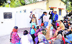 Shiksha acharyas hold a protest demonstration in front of Education Minister Mantri Prasad Naithanis residence in Dehradun on Tuesday