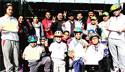 Ice skaters, who participated in the 10th National Ice Skating Championship in Shimla, being honoured at a function in Dehradun on Tuesday
