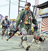 Security personnel at the encounter site in Sopore in Baramulla district on Tuesday
