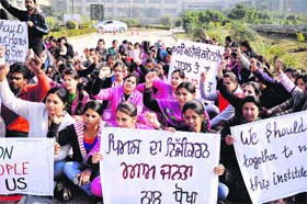 Striking nurses, parmedical and clerical staff of the Punjab Institute of Medical Sciences (PIMS) protest against the Punjab Government and the PIMS management for the non-payment of their salaries in Jalandhar on Tuesday