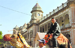 A visitor enjoys a camel ride in front of the Mubarak Mandi complex in Jammu. 
