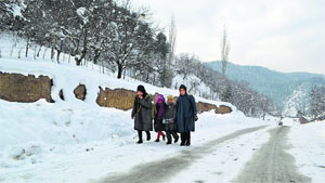 Children head for tuitions near Daksum in Anantnag on Tuesday.