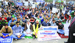Village-level entrepreneurs, under the banner of the J&K Common Service Centre Association, stage a protest in Jammu on Tuesday.
