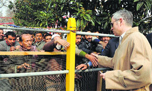 Chief Minister Omar Abdullah shakes hands with party workers in Srinagar