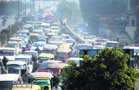 Motorists caught in a traffic jam due to the Congress protest in Ludhiana on Tuesday