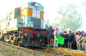 MLA Manpreet Singh Ayali flags off a train at Ghungrana near Mandi Ahmedgarh on Tuesday