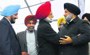 Hockey Olympian Balbir Singh (centre) is greeted by Punjab Deputy CM Sukhbir Singh Badal at the inauguration of Punjab Olympics Bhawan in Mohali on Tuesday. 