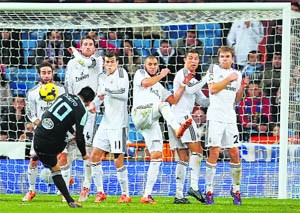 Celta Vigos Nolito tries to score past Real Madrids Daniel Carbajal, Sergio Ramos, Gareth Bale, Karim Benzema, Cristiano Ronaldo and Asier Illarramendi during their La liga match in Madrid. 