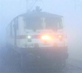 Foggy view: Trains run engulfed by fog at Amritsar railway station on Wednesday