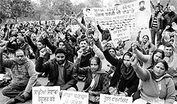 Members of the Pharmacists Union, Punjab, protest on the road separating Sectors 51 and 52 in Chandigarh on Wednesday