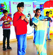 Students of Oakridge International School perform during an inter-house human puppet show