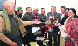 Chief Minister Vijay Bahuguna being greeted by his colleagues prior to the start of Cabinet meeting in Dehradun on Wednesday. A Tribune photograph