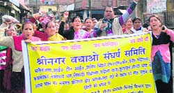 Members of the Srinagar Bachao Sangharsh Samiti hold a protest in support of their demands at Srinagar on Wednesday. A Tribune photograph