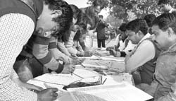 INLD supporters participate in a signature campaign against the HCS recruitment scam in Gurgaon on Wednesday. Tribune Photo: Sayeed Ahmed