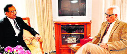 Chander Prakash, Chief Post Master General, Jammu and Kashmir, with Governor NN Vohra at Raj Bhawan in Jammu on Wednesday