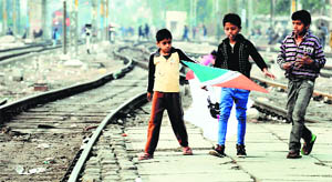 Children catch kites on tracks at the Ludhiana railway station.