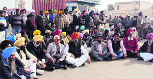 Protestors block traffic in Jagraon on Wednesday. 