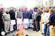 Congress workers burn Punjab Cabinet Minister Bikramjit Singh Majithias effigy in Doraha on Wednesday. 