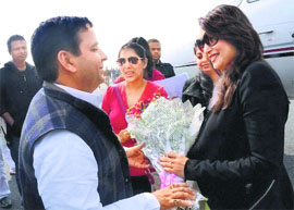 Samajwadi Party MP Dharmendra Yadav greets Madhuri Dixit at the Saifai airport in Lucknow on Wednesday.
