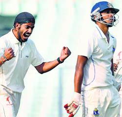Railways Anureet Singh celebrates the dismissal of a Bengal batsman in Kolkata on Wednesday. 