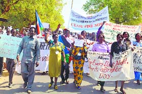 South Sudan Civil Society Alliance workers hold a march denouncing the ongoing fighting and urging for a cease fire, in Juba on Wednesday