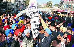 Shiromani Akali Dal workers protest against PPCC president Partap Singh Bajwa in Amritsar on Thursday