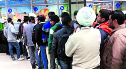 Applicants stand in a queue at Suvidha Centre in Bathinda