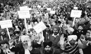 Members of the PUDA Employees Cooperative Sangharsh Committee, Punjab, hold protest in front of their office in Phase VIII, Mohali, on Thursday. 
