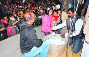 A child picks a slip during the draw of lots for admission to a private school in Chandigarh. 