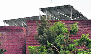 A 50 kWp grid interactive rooftop SPV power plant; and (right) a solar light at Government Model Senior Secondary School, Sector 46, Chandigarh. 
