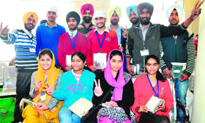 Students flash victory signs after being honoured during a function organised by Bhai Jaita Foundation in Chandigarh on Thursday. 